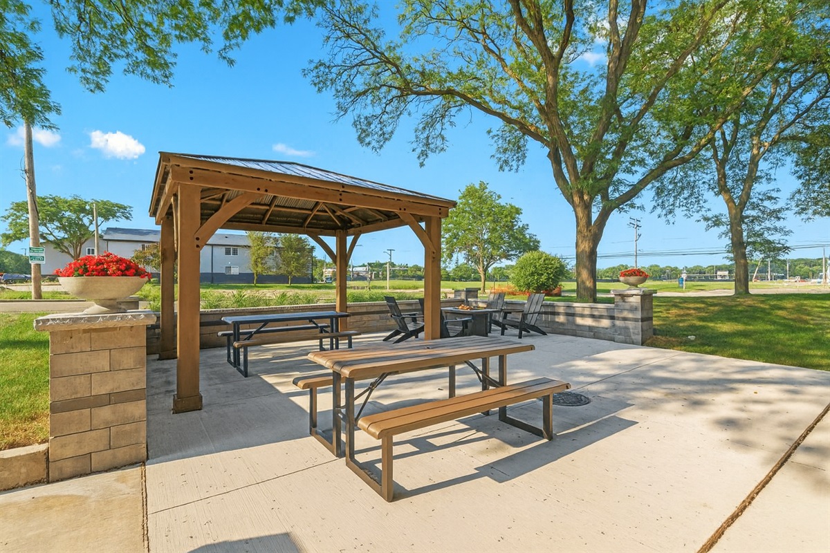 Covered outdoor seating area with a picnic table—great for breakfast, coffee, or working outside.