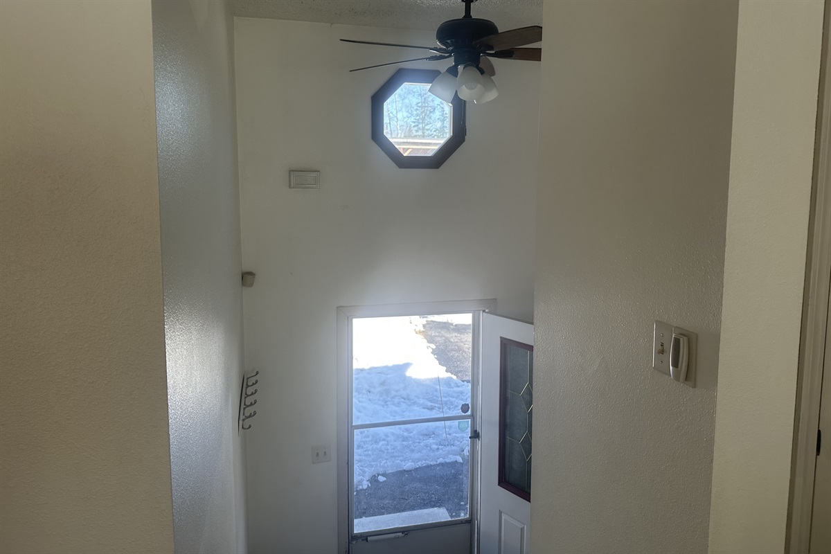 This is a split level home with stairs to the basement or the main floor from the entrance