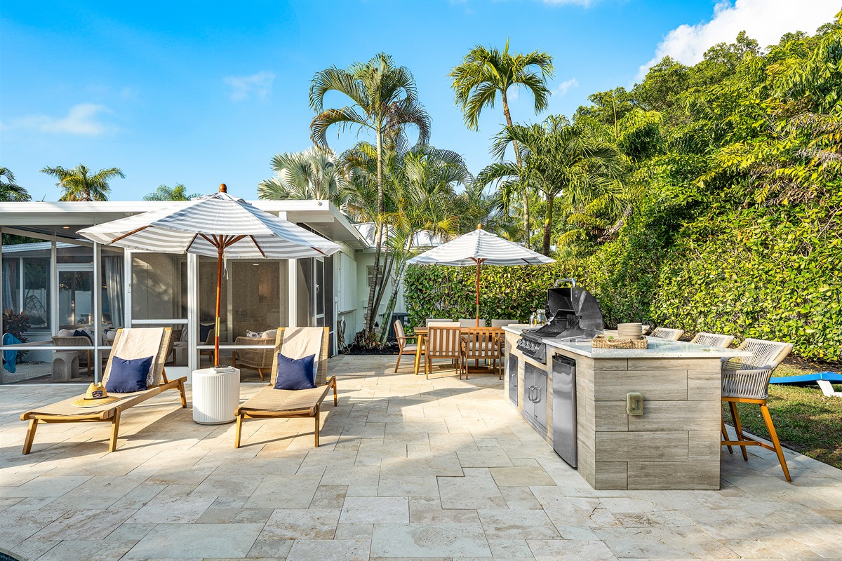 Grill Master Ready! Host the perfect cookout with our dedicated outdoor grilling station, conveniently located near the pool and shaded seating area.