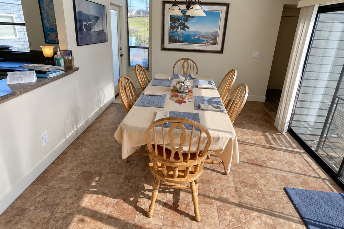 Dining area next to kitchen and overlooking hot tub deck