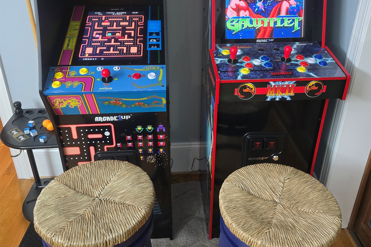 Full-sized arcade machines featuring 26 classic arcade games.