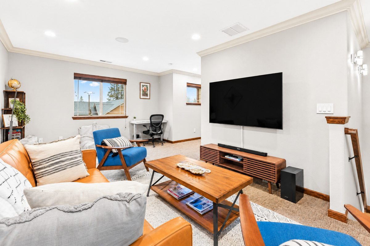 Sink into cozy relaxation on the sofa while enjoying your favorite shows on the expansive 65-inch smart TV with Netflix and Samsung TV.
