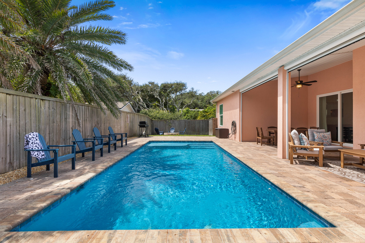Private pool, heated October through April, runs right alongside the covered lanai, so swimmers stay in easy view.