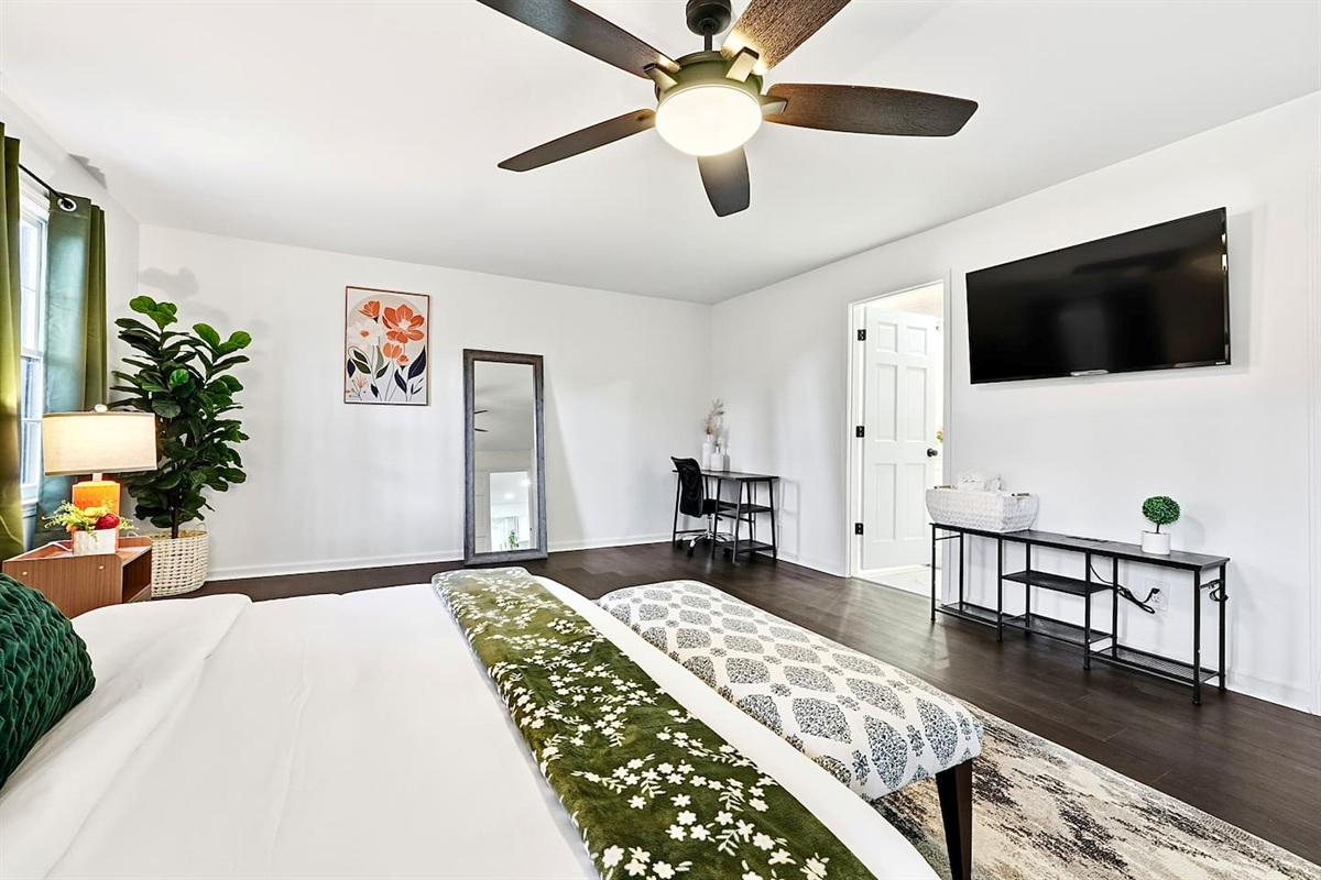 Spacious first-floor master bedroom located to the far right as you enter through the front door. This earthy, calming retreat features a king bed and smart TV. This room includes 2 full-body towels, 2 washcloths, and 2 hand towels for your stay.