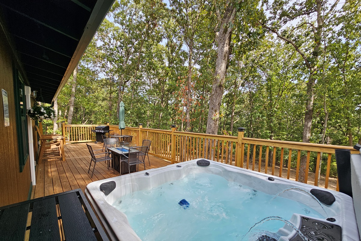 Enjoy dinner on the deck, fire up the grill, then slip into the hot tub — all with a peaceful forest view.