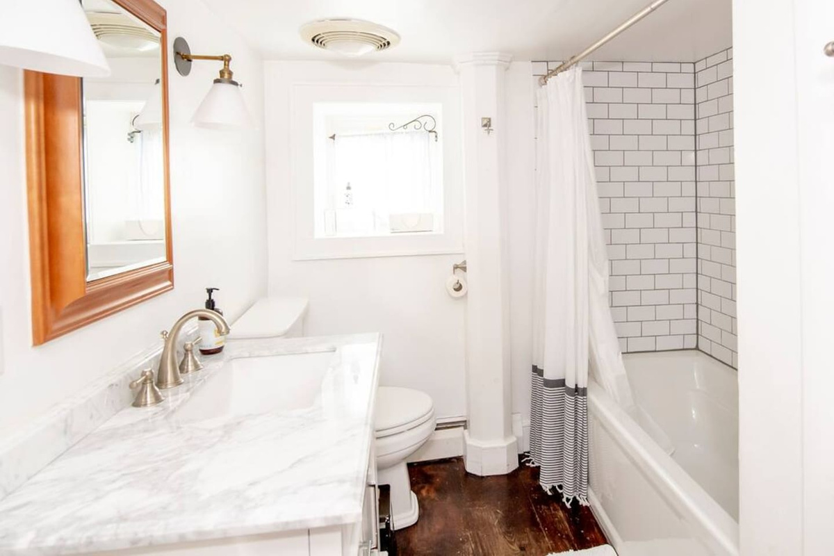 Downstairs second bathroom with shower and tub