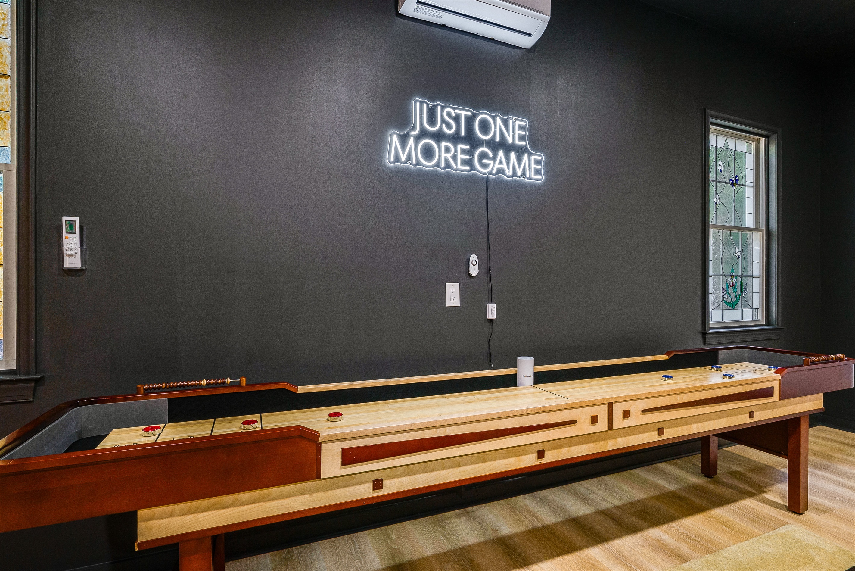 Just one more game!’ — the shuffleboard table is always a crowd favorite for both kids and adults