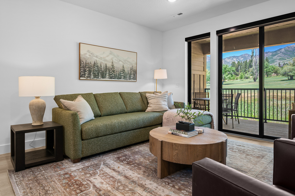 Experience the Cozy Living Room Outfitted with Plush Seating, Smart TV, and also a Private Fireplace.