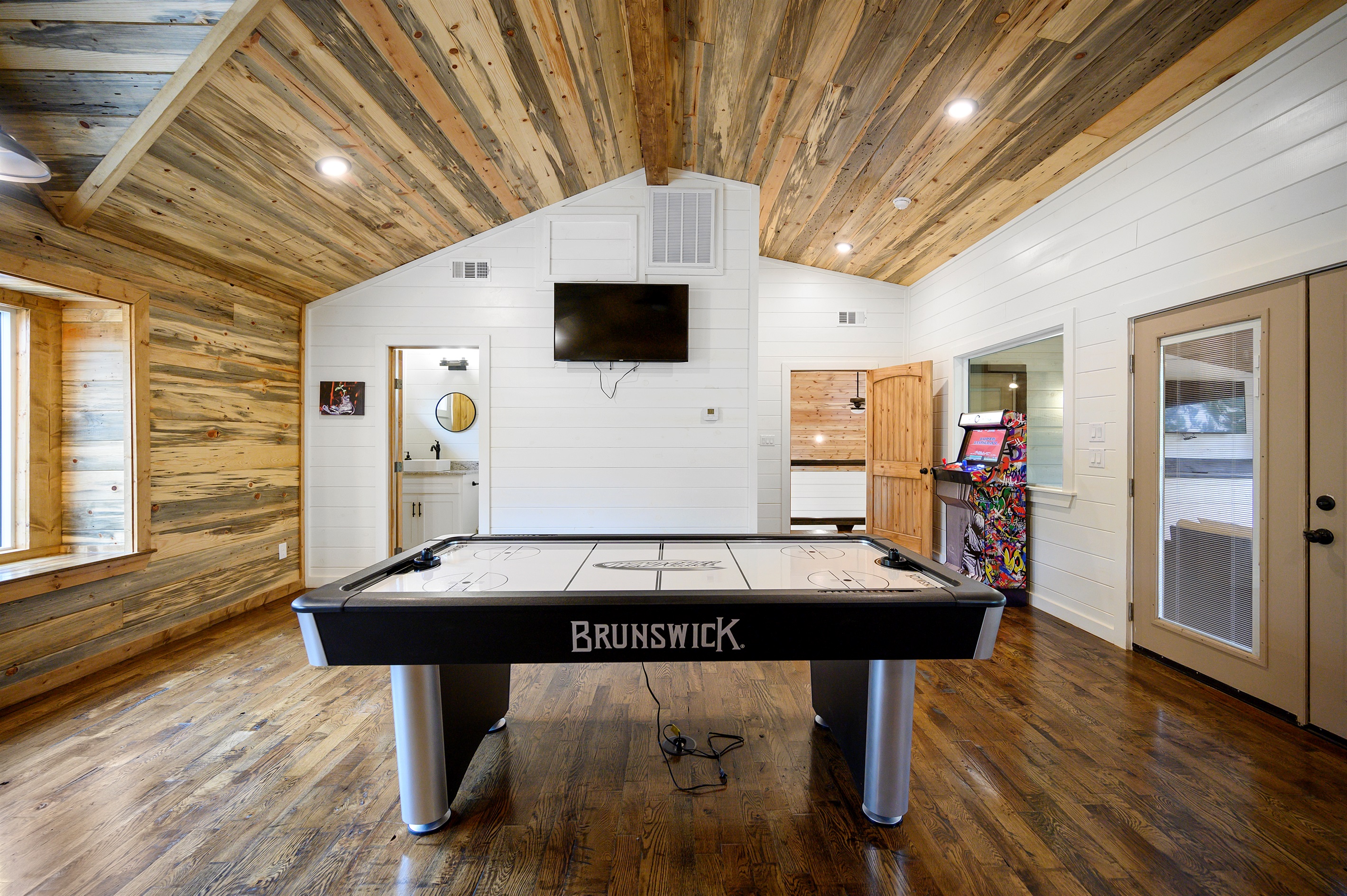Air hockey battles in the game loft tend to get loud in the best way possible. 
Fast hands, friendly rivalries, and nonstop rematches turning this upstairs hangout into everyone’s favorite part of the cabin.