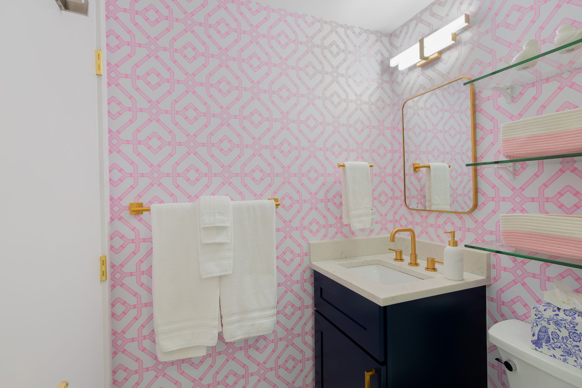 The mirror is a medicine cabinet and opens up for your belongings during your stay.