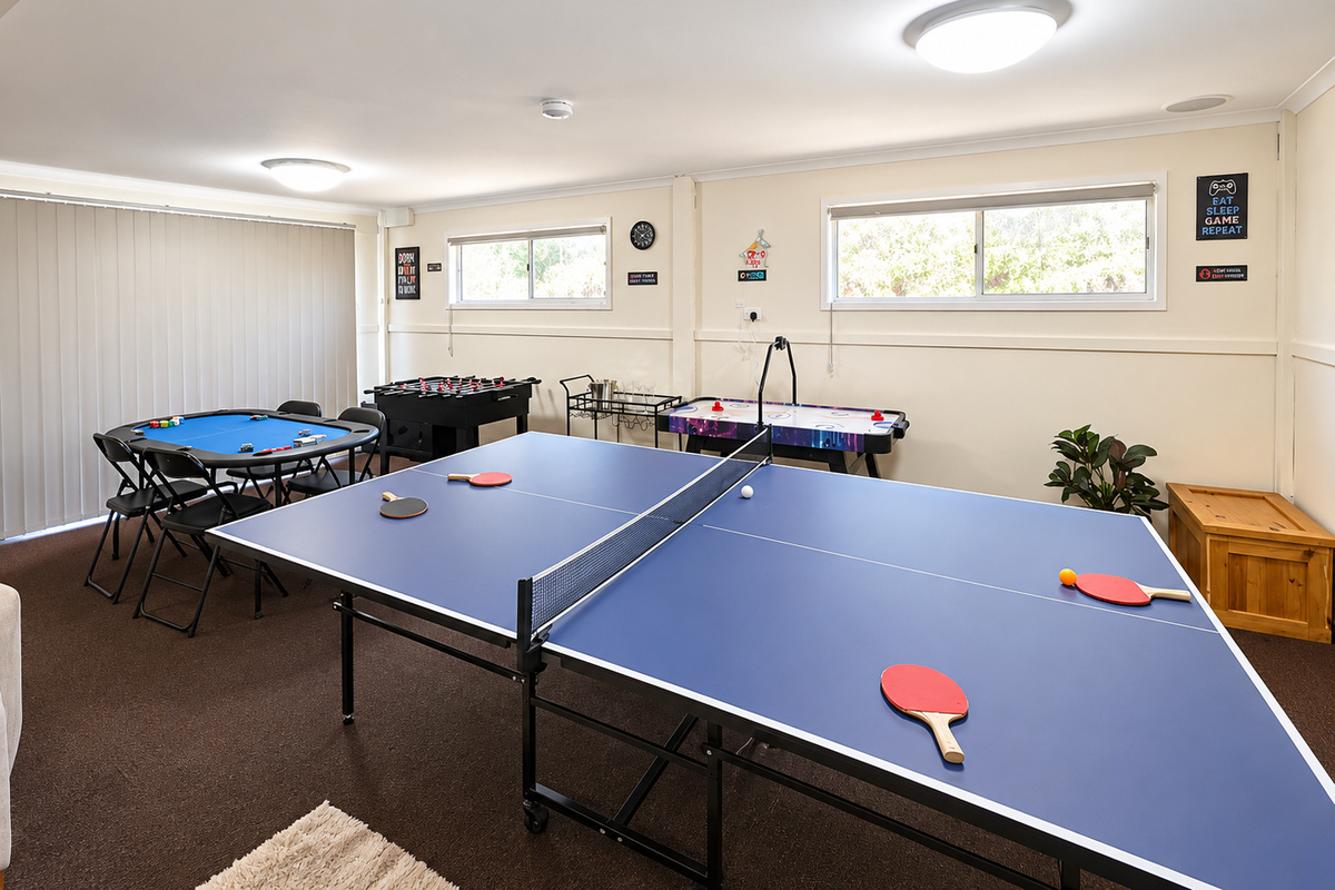 The downstairs games room at Carlenes Getaway adds a fun indoor space with table tennis, air hockey and foosball.