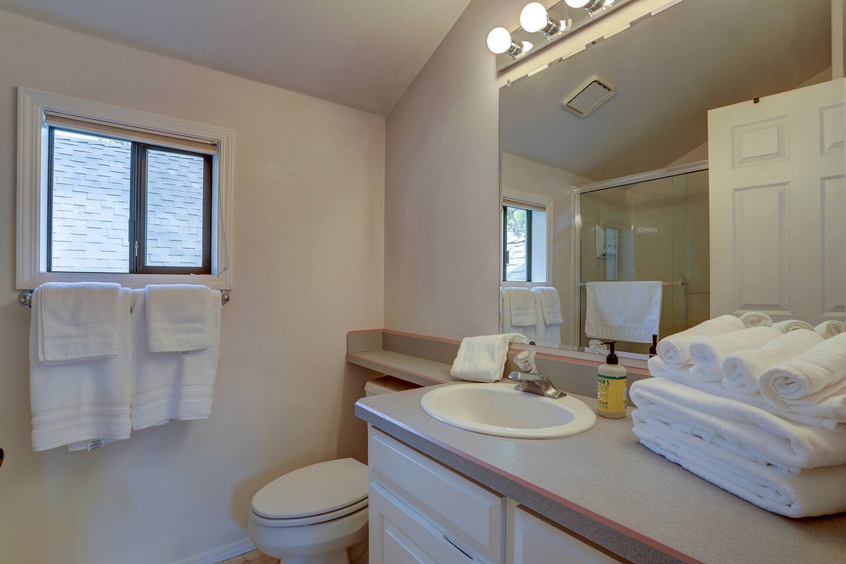 This full bathroom is adjacent the kids' bunk room upstairs and features a full bath tub. 