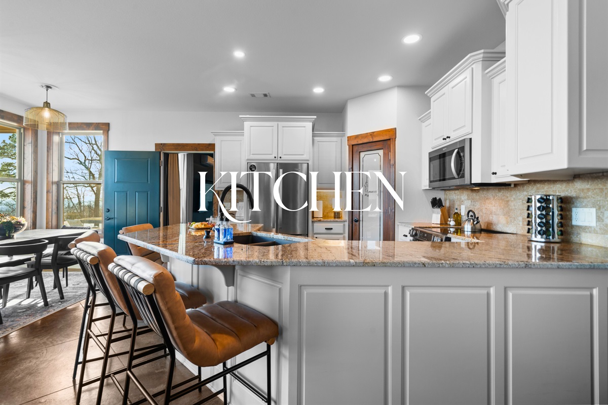 The kitchen island offers plenty of room for morning coffee chats or evening appetizers while meals come together with ease.