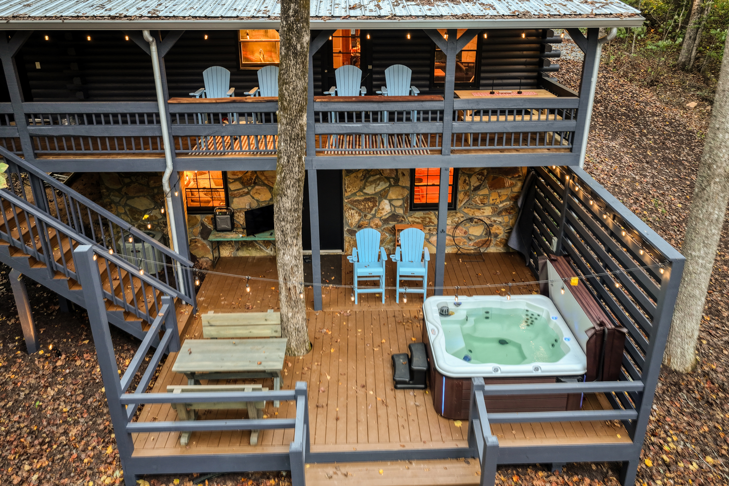 Multi-level decks with a hot tub .
