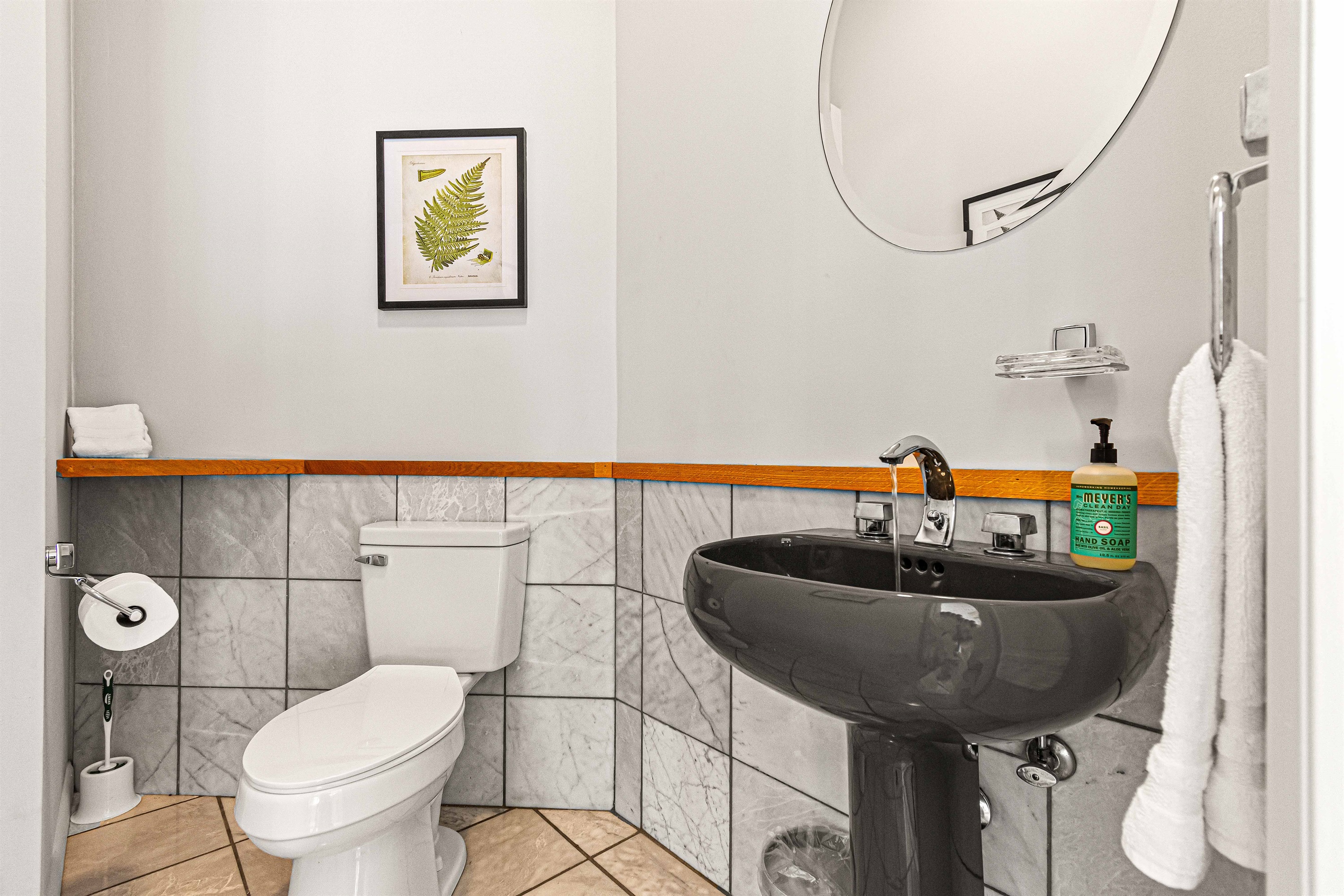 Half Bath: Stylish and modern space with elegant decor and refined finishes just for you!
