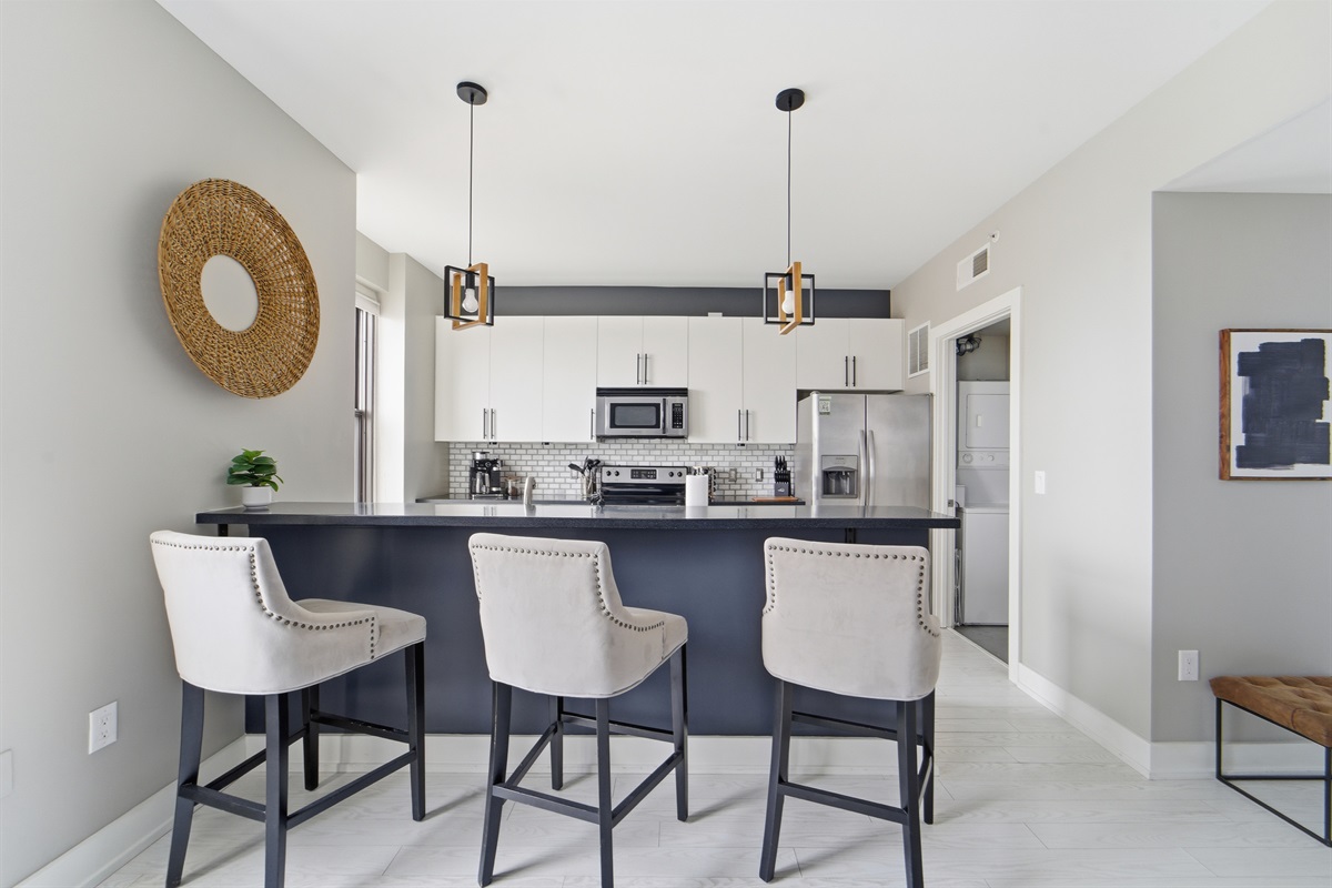 Three large comfy high top chairs are perfect for entertaining while cooking your favorite meals.