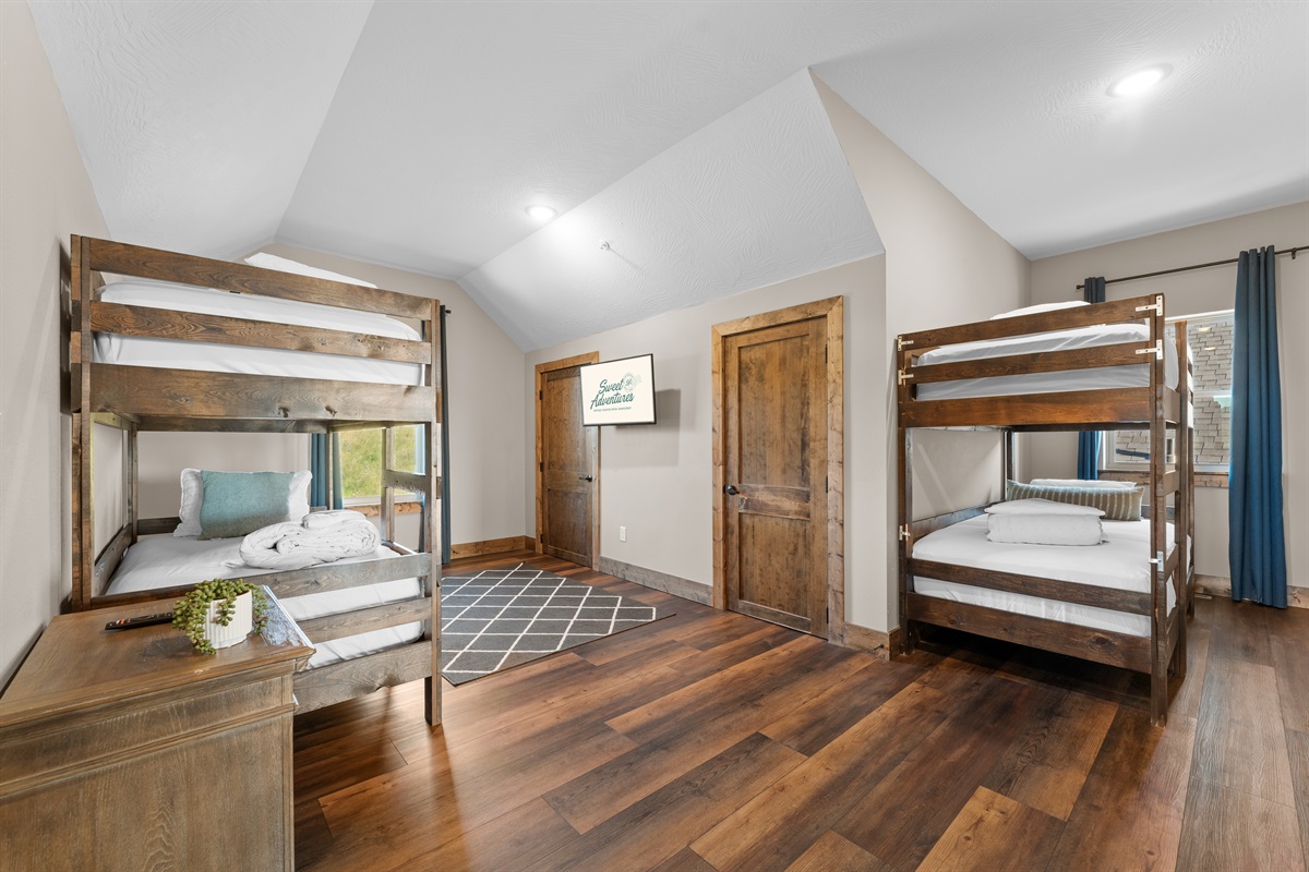 Bunk room with luxury mattresses and linens for sound sleeping after a day of adventure.