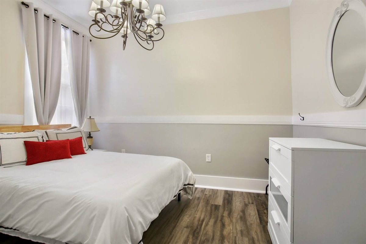 Bedroom 3. 1 queen bed, blackout curtains, 39" smart tv, dresser.