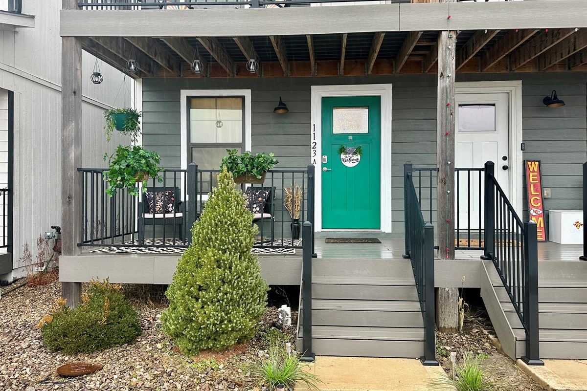 Front elevation showcasing the home’s clean lines, modern exterior, and private upper balcony.