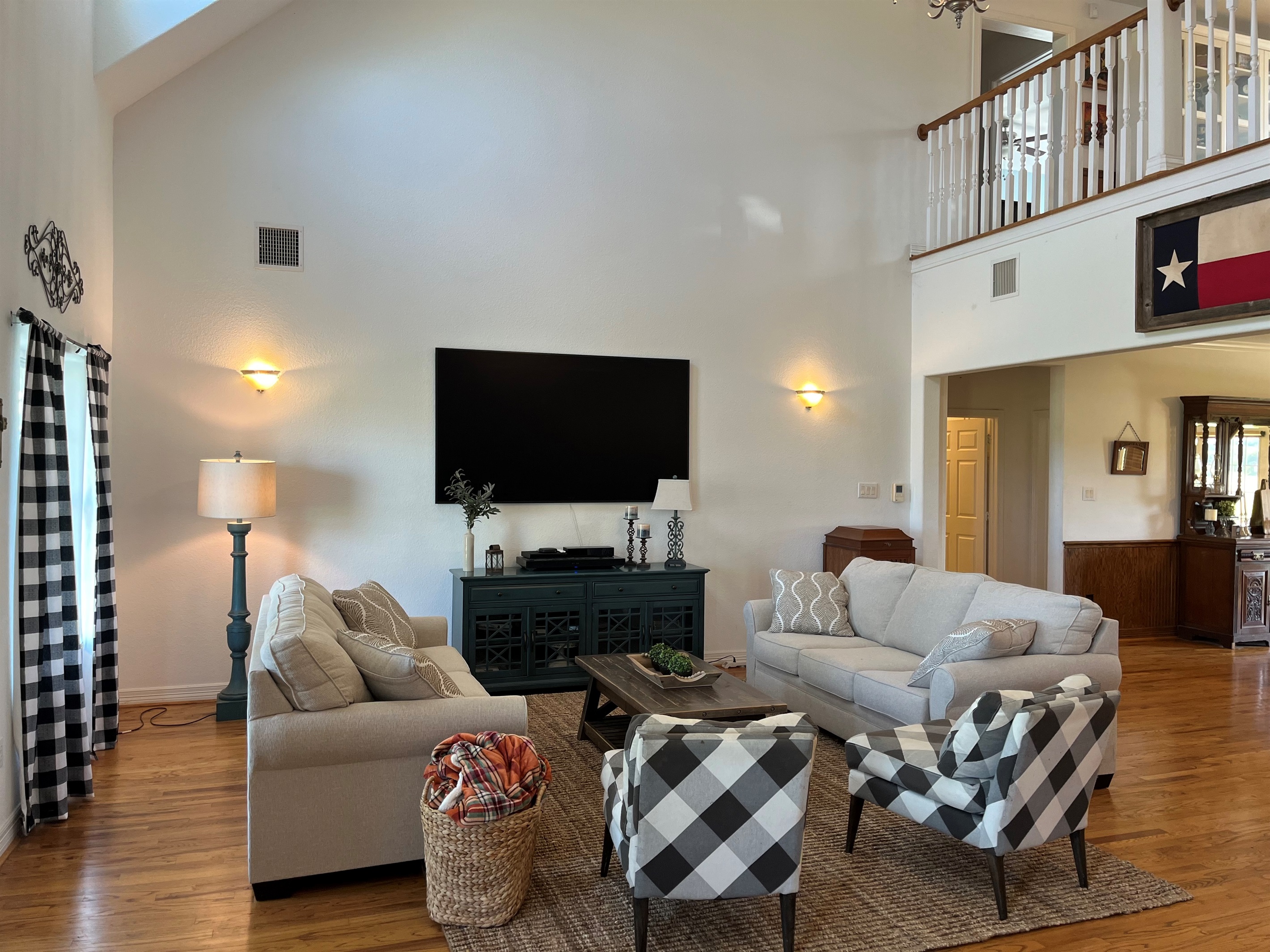 85 inch picture frame flat screen TV in a huge living room.