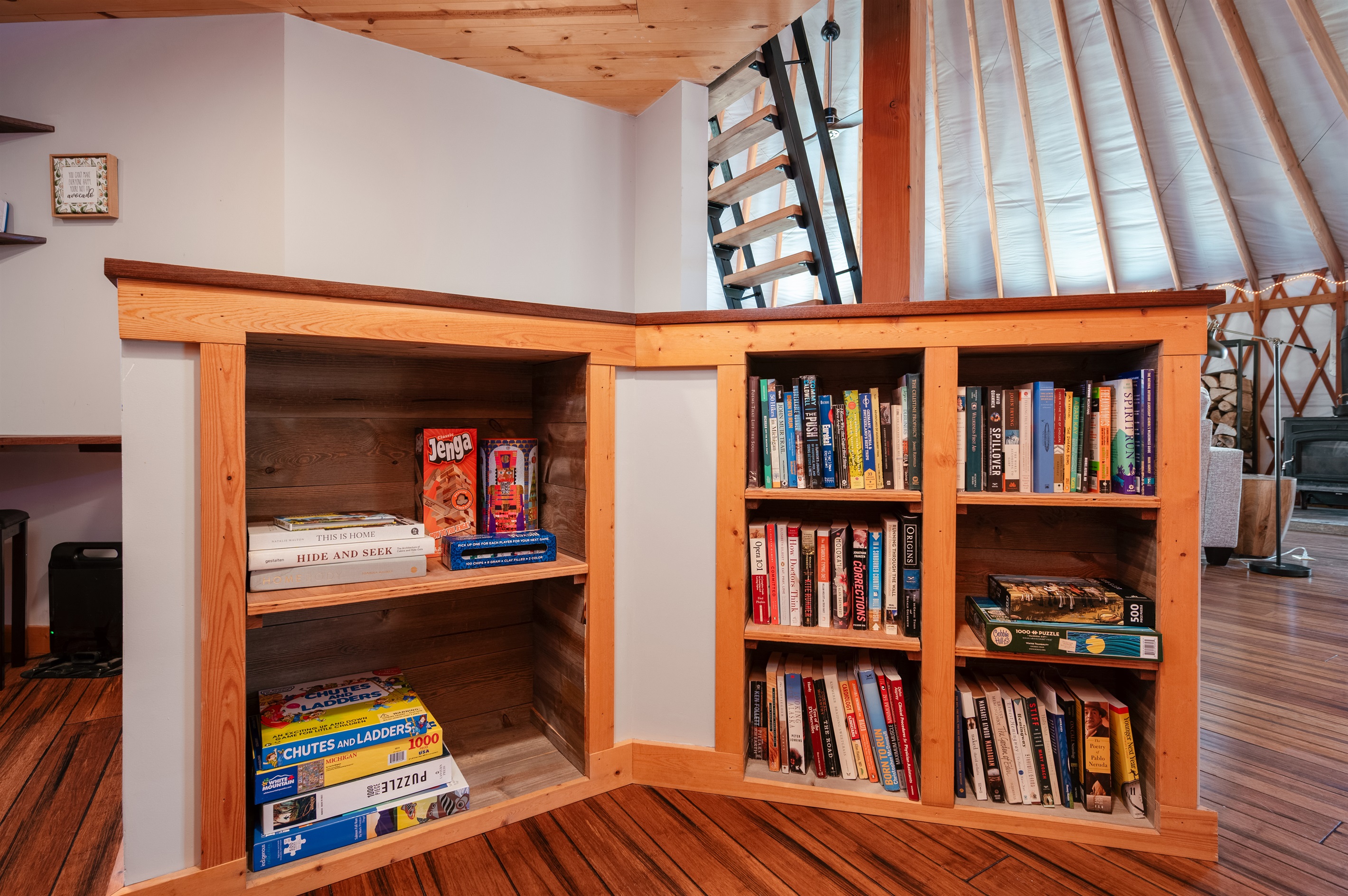 Cozy reading nook stocked with books, puzzles, and games, the perfect spot to unwind after a day exploring or rainy day activities. 