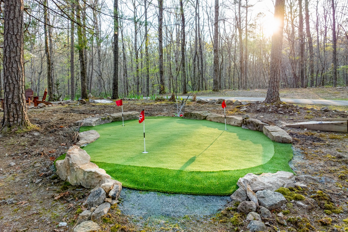 Enjoy outdoors with putting green, horse shoe, corn hole and firepit