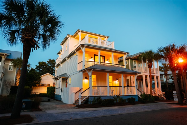 The property glows at night — a glimpse of the ambiance waiting for your group after a day on 30A.