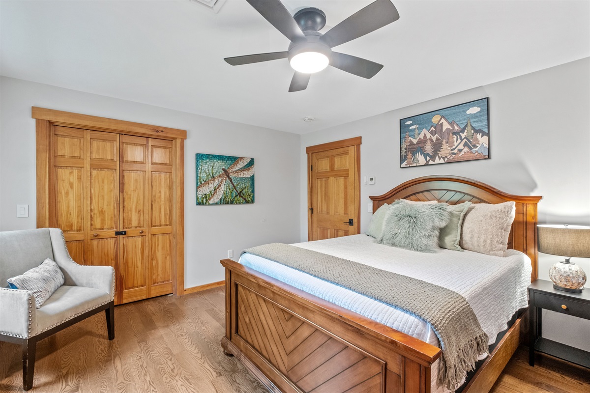 Second floor ensuite bedroom with queen bed and bunk bed and its own bathroom with shower