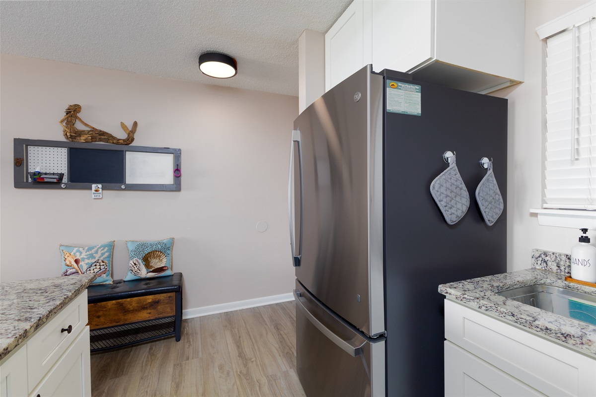 A spacious refrigerator and a stylish sink