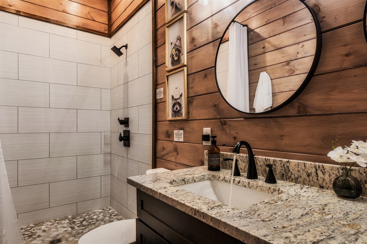 Bathroom 6 (bunk room) en suite full bathroom with double vanity and walk-in shower