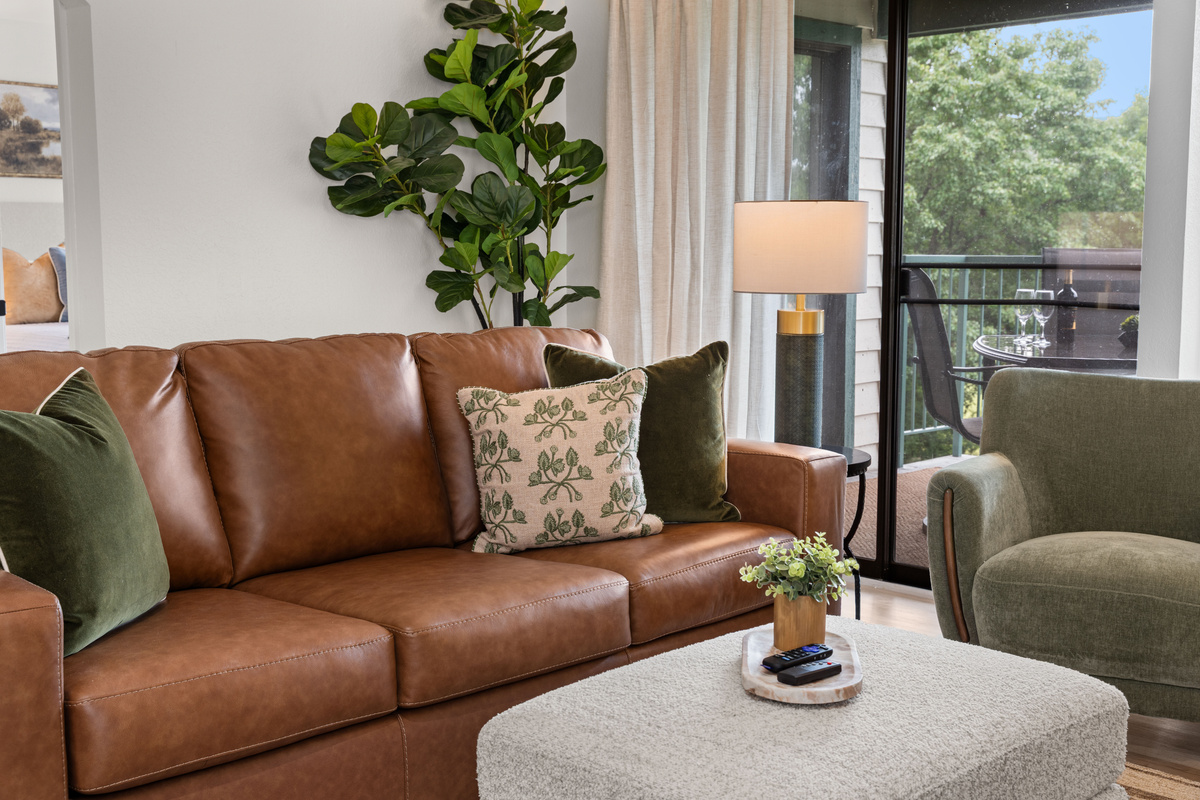 The leather sofa converts into a pullout bed for two guests.