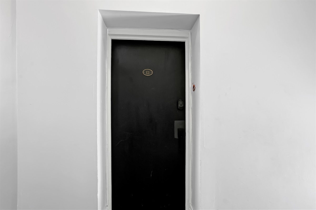 Black door marks your private entrance to Oak & Ivy Hideaway.