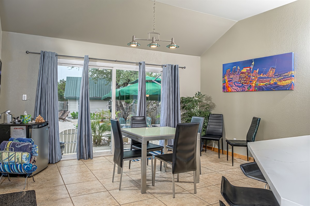 Kitchen table extends for extra seating, oversized series E glass doors and windows allow for lots of natural light without the heat. High vaulting ceilings and open floor plan for very spacious feel to entire home.