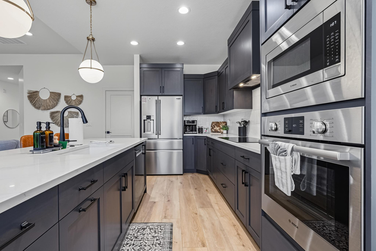 Enjoy a modern kitchen featuring stainless steel appliances and plenty of counter space for cooking and meal prep.