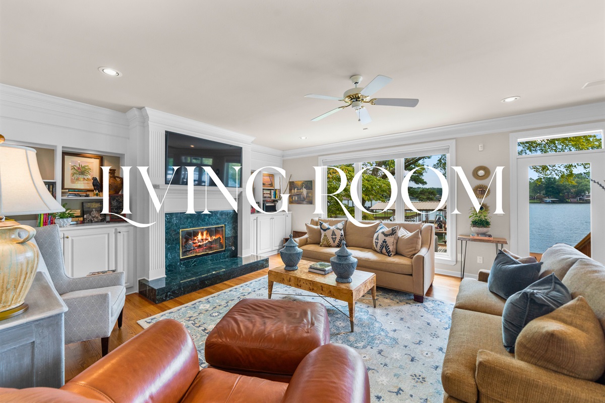 A cozy living room with a fireplace and stylish touches &mdash; a gathering place for every season.