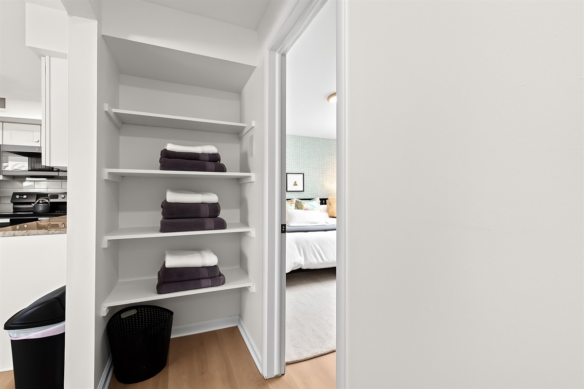 Walk-in closet with ample shelving and space to unpack and stay organized throughout your stay.