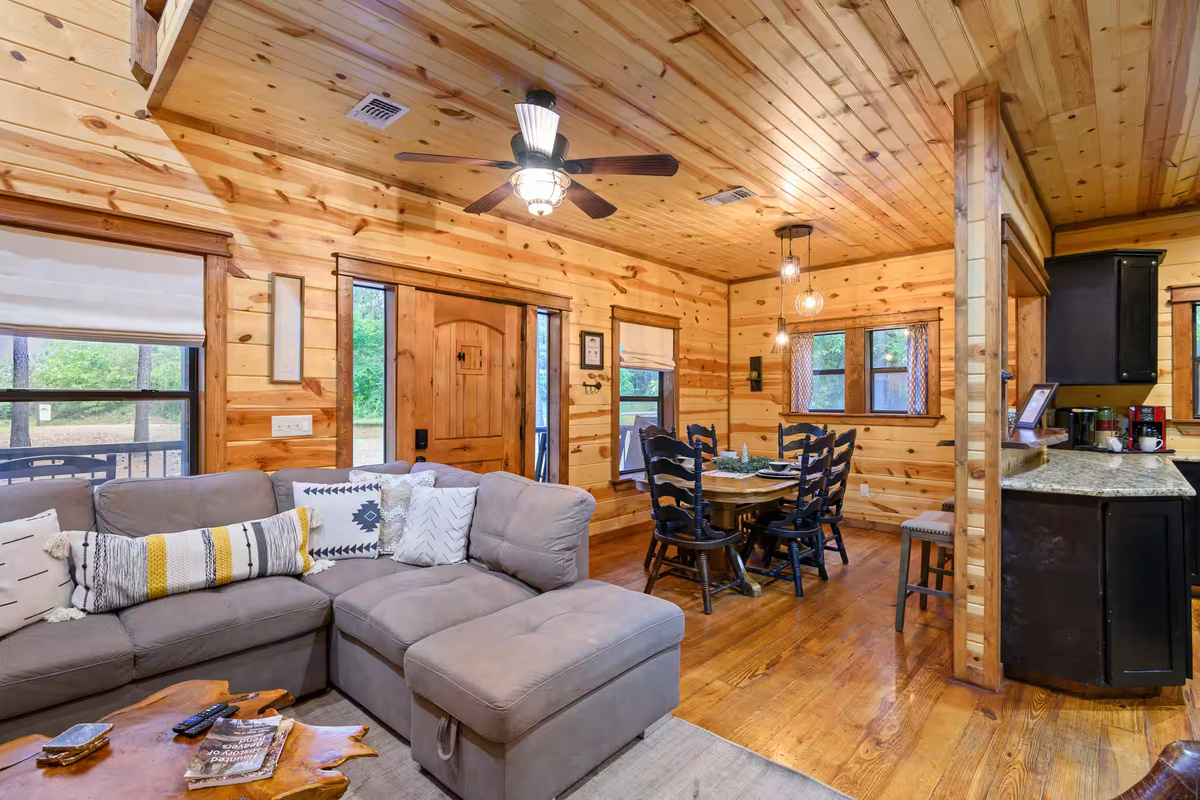 Living Room: Relax in style with wood accents, plush seating, and a charming dining nook!
