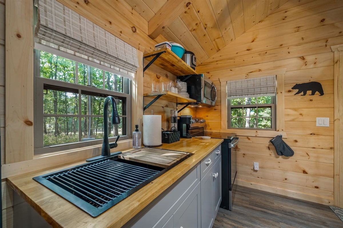 Full kitchen with full size stove and microwave