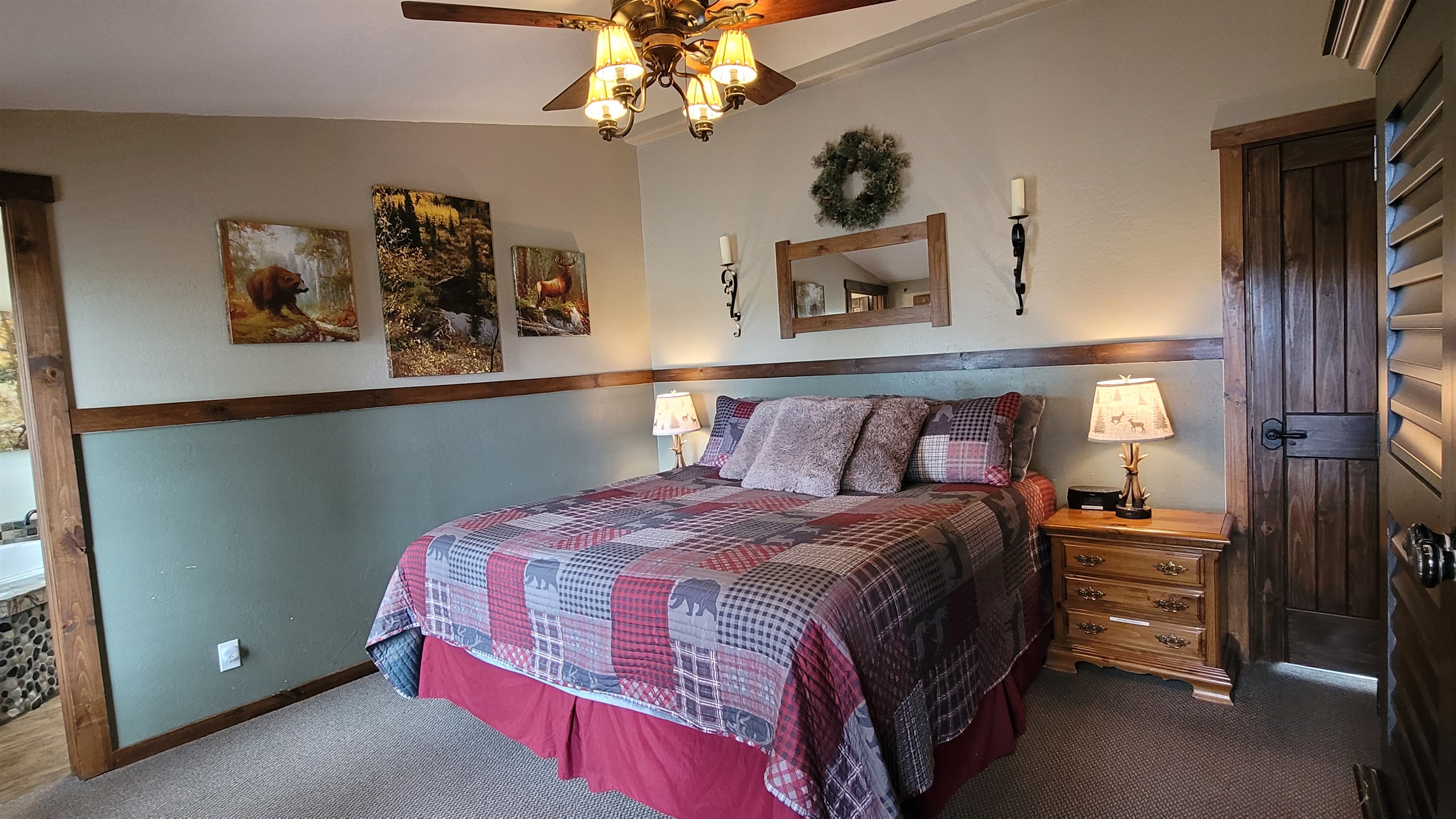 King size bed, smart TV, armoire and dresser for clothing storage.