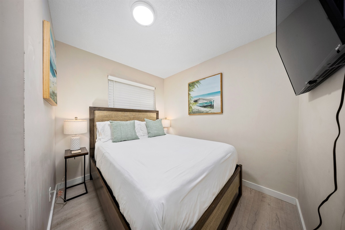 Guest bedroom with a queen bed and Smart TV