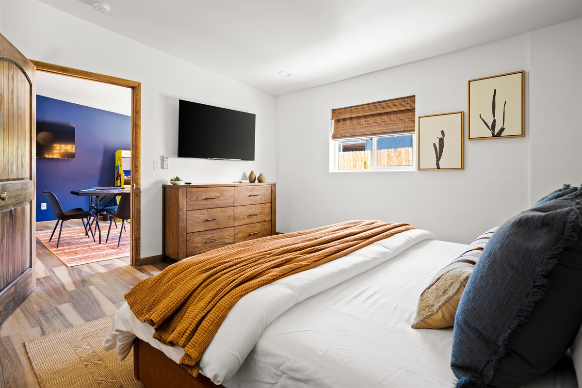 Primary bedroom with king bed, Smart TV, and direct access to the game room!