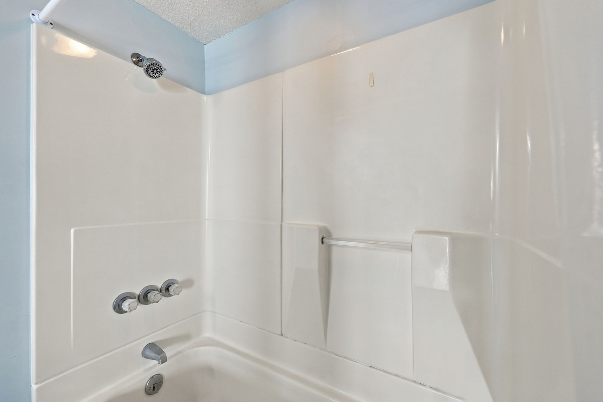 Clean and modern shower-tub combo to wash off the sand and refresh.
