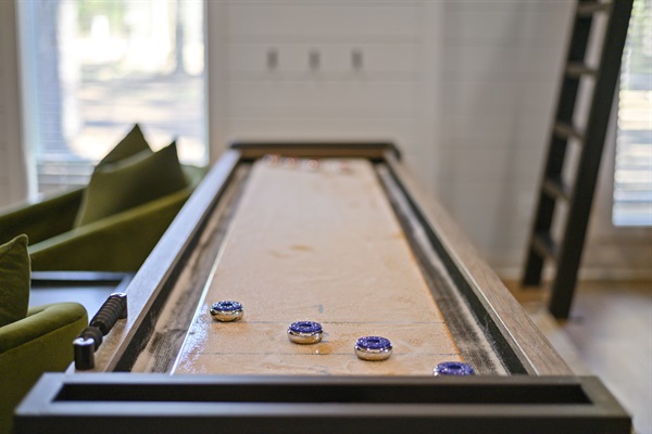 Shuffleboard table in the game room for hours of fun!