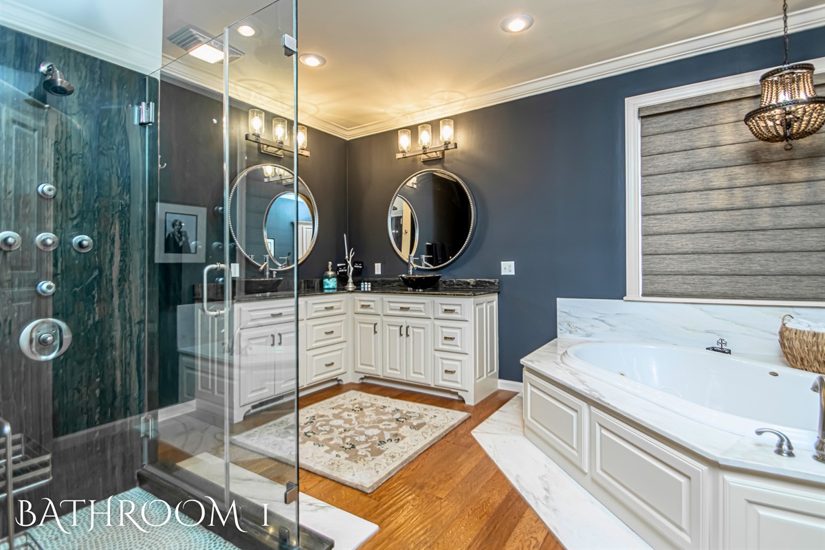 Custom Ensuite Bathroom in the Primary Bedroom with Dual Sink Vanity, Large Walk-In Shower and Soaking Tub