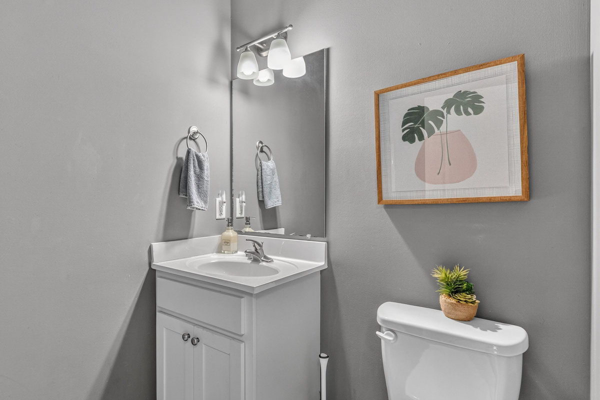 Bath 2: The main floor bathroom is directly across from the bedroom