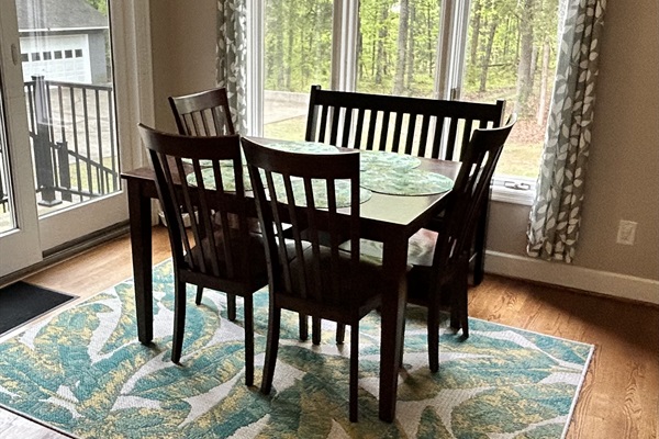 Breakfast Nook with amazing view of the wooded area and down to the lake