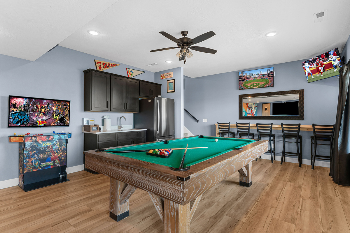 Sports bar, pool table, seating area, and arcade system