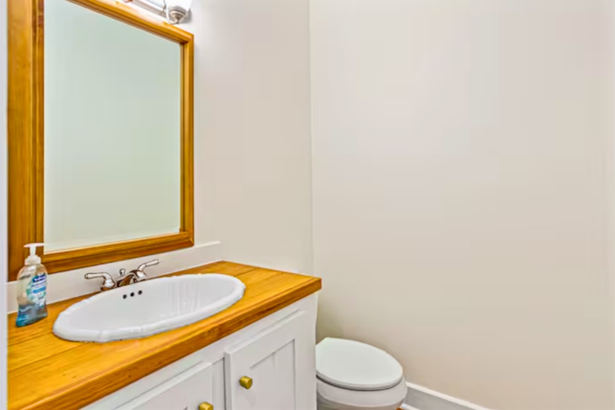 Half Bath Close to the Living Room and Kitchen