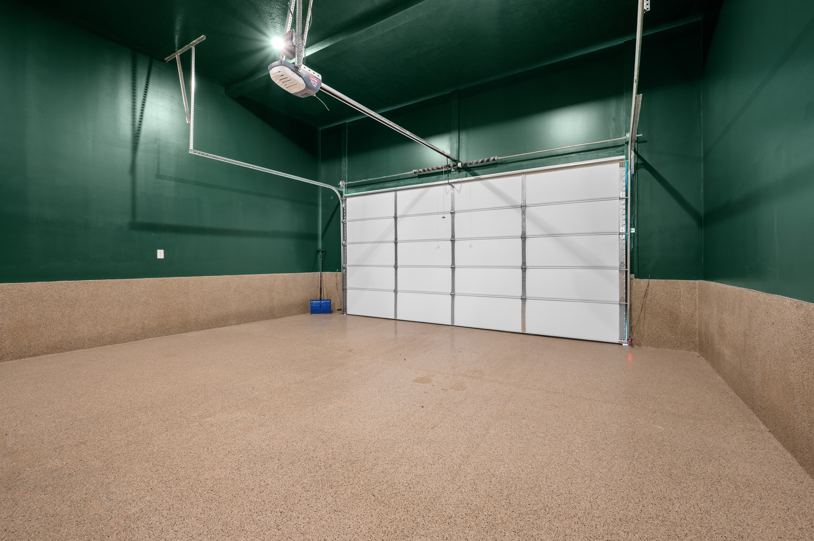Epoxy coated two car garage with large tandem area for storage or small car (2 garage openers provided)