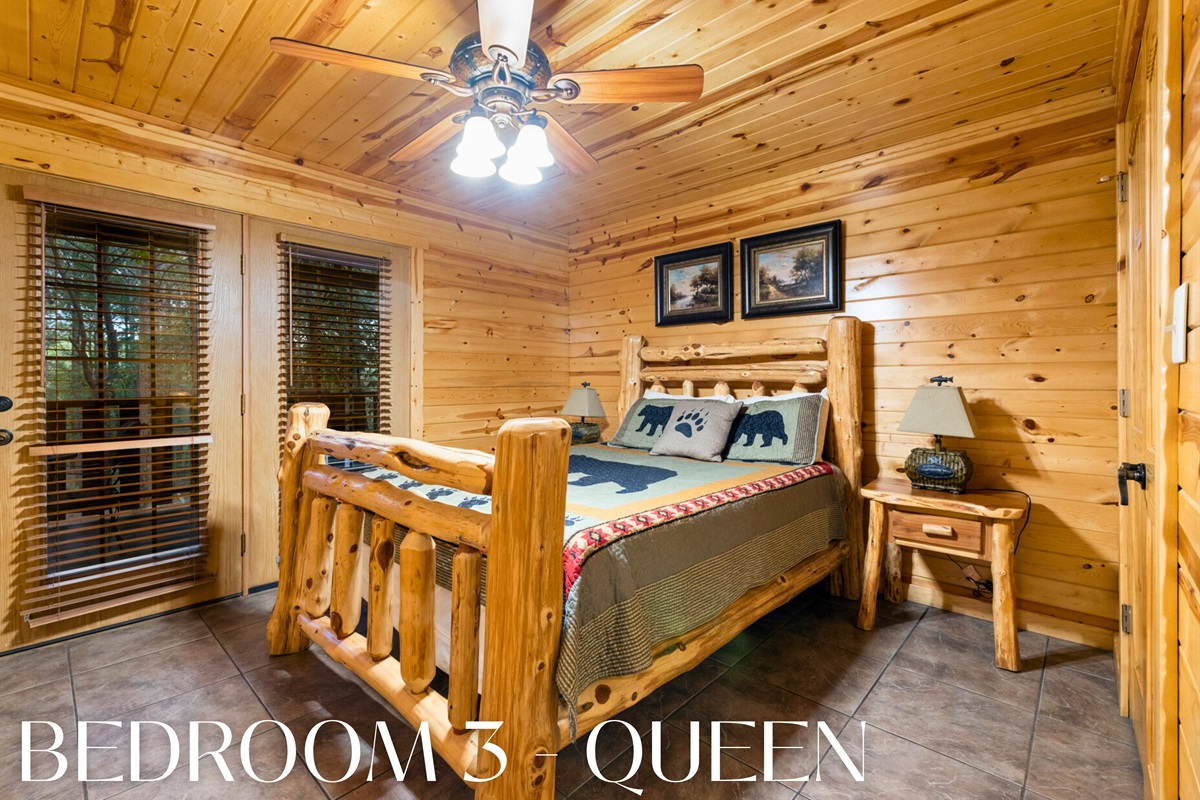 Bedroom 3 with queen bed and bright cabin atmosphere